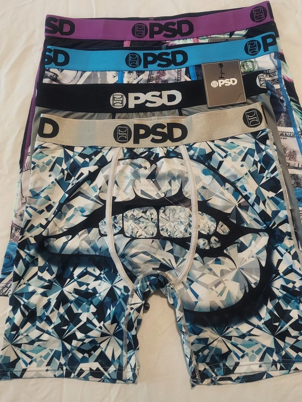 PSD Boxer Brief 4-Pack – Blue Floral Money, Purple Palm, Gray, Blue Geometric.